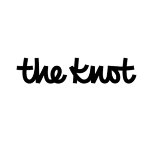 Logo for the wedding website, The Knot. The logo is the words "the knot" in black, cursive writing over a white background.